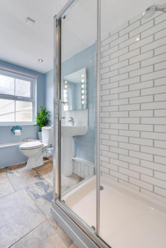 a bathroom with a glass shower and a toilet at 2 Bed in Marazion oc-p00598 in Marazion