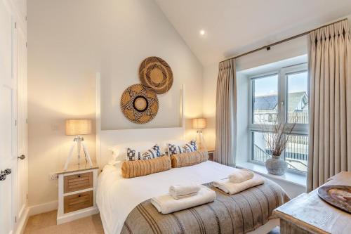 a bedroom with a large bed and a window at 2 Bed in Padstow oc-t29016 in Padstow