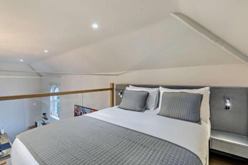 a bedroom with a large bed with two pillows at 1 Bed in Kinsham oc-t30051 in Kinsham