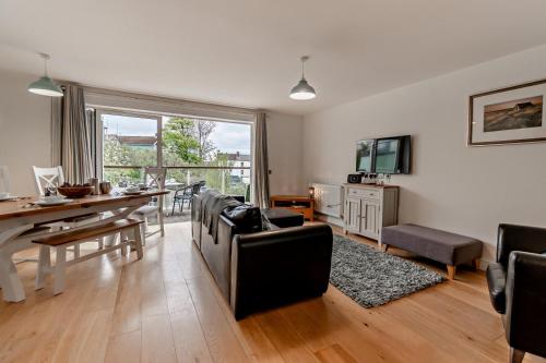 a living room with a table and a dining room at 5 Bed in Sardis oc-m28337 in Saundersfoot