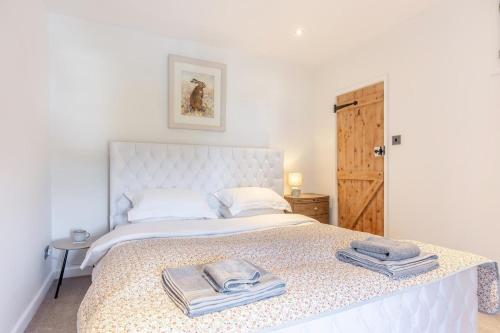 a bedroom with a bed with towels on it at 1 Bed in Harlech oc-t32043 in Harlech
