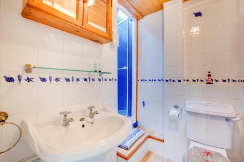a bathroom with a sink and a toilet at 2 Bed in Docking oc-913 in Docking