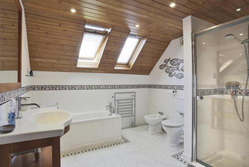 a bathroom with a toilet and a sink and a shower at 5 Bed in Walberswick oc-hferin in Walberswick