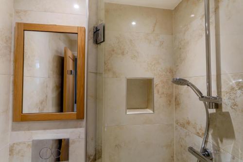 a bathroom with a shower and a mirror at 2 Bed in Knaresborough oc-w31758 in Knaresborough