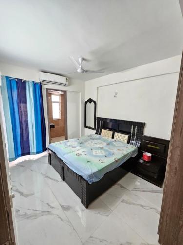 a bedroom with a bed in a room at Cozy corner in Gurgaon