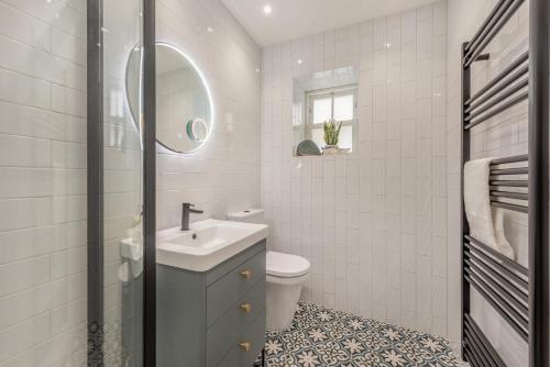 a white bathroom with a sink and a toilet at 3 Bed in New Quay oc-c29640 in New Quay