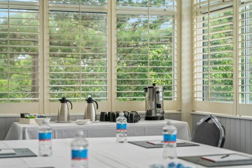 a room with two tables with water bottles on them at Silkari Mirage at Newport in Newport