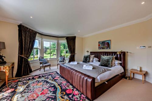 a bedroom with a large bed and a large rug at 6 Bed in Robertsbridge oc-d29525 in Brightling