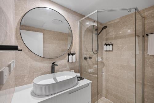 a bathroom with a sink and a mirror at Silkari Mirage at Newport in Newport
