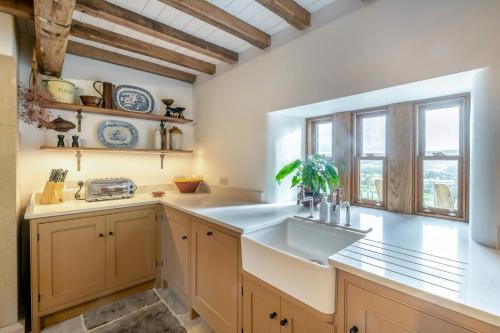 a kitchen with a sink and a window at 4 Bed in Cowling oc-h30773 in Cowling