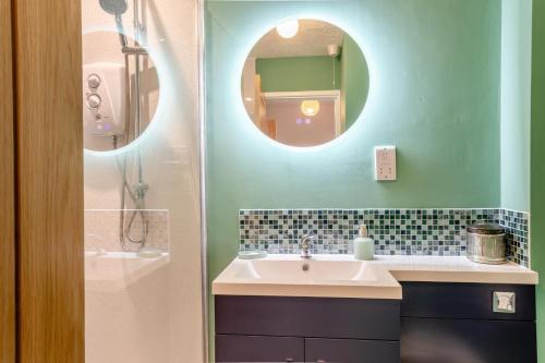 a bathroom with a sink and a mirror at 2 Bed in Snettisham oc-d31668 in Snettisham