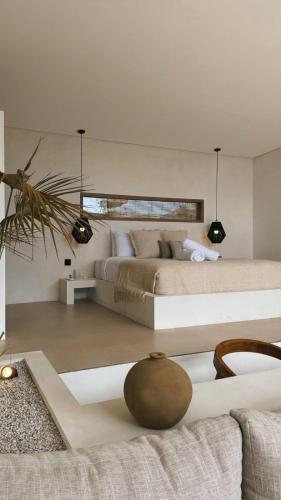 a bedroom with a large bed in a room at Arenas Blancas VILLA 1 in Uluwatu