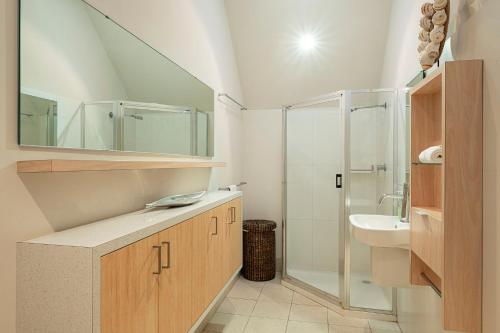 a bathroom with a sink and a shower at Apt 9 'Delphinius' @ Bay View Centro, Dunsborough in Dunsborough