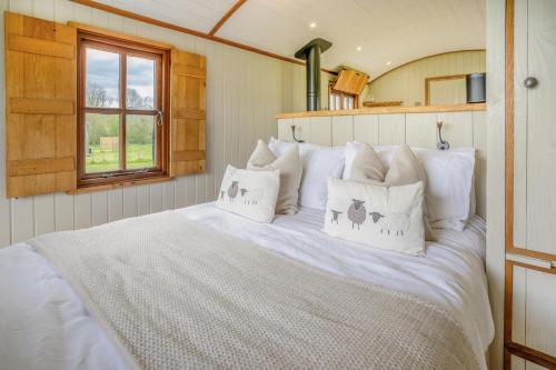 a bedroom with a white bed with pillows at 1 Bed in Bronllys oc-t31950 in Bronllys