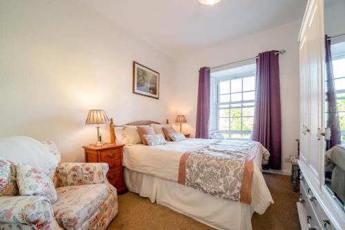 a bedroom with two beds and a window at 2 Bed in Moffat oc-a32121 in Moffat