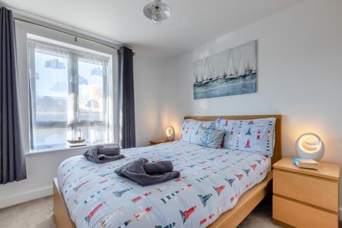 a bedroom with a bed with towels on it at 2 Bed in West Bay oc-d31037 in West Bay