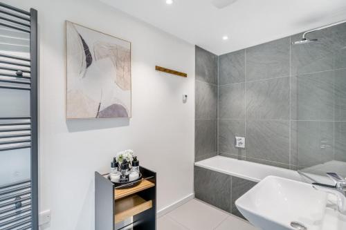 a bathroom with a sink and a bath tub at 1 Bed in Backbarrow oc-s32477 in Backbarrow