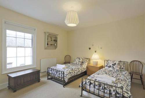 a bedroom with two beds and a window at 2 Bed in Southwold oc-aathco in Southwold
