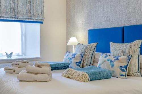 a bedroom with a bed with towels on it at 3 Bed in Bamburgh oc-gd0468 in Bamburgh