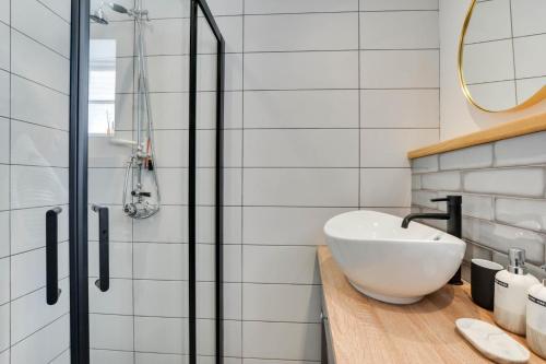 a bathroom with a sink and a glass shower at 2 Bed in Padstow oc-p00876 in Padstow