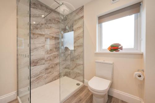 a bathroom with a shower and a toilet at 3 Bed in Saundersfoot oc-pw9274 in Saundersfoot