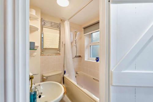 a bathroom with a sink and a toilet and a tub at 2 Bed in Burtersett oc-g28336 in Hawes