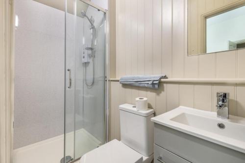 a bathroom with a shower and a toilet and a sink at 2 Bed in Snettisham oc-t29559 in Snettisham