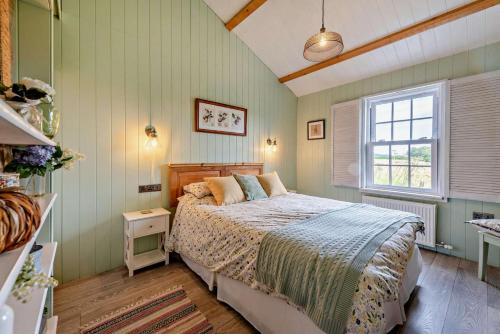 a bedroom with a bed and a window at 1 Bed in Dre-Fach Felindre oc-a29876 in Felindre