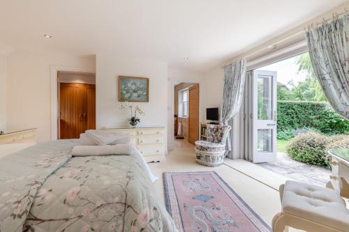 a bedroom with a bed and a large window at 4 Bed in Wareham oc-r30563 in Wareham