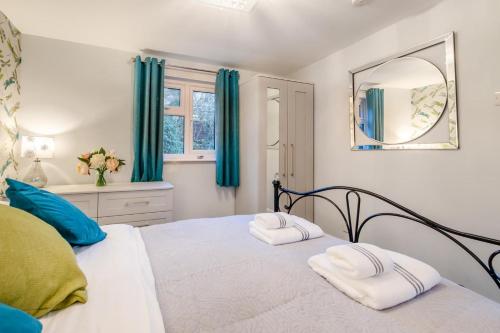 a bedroom with a bed with two towels on it at 1 Bed in Flimwell oc-s30131 in Ticehurst