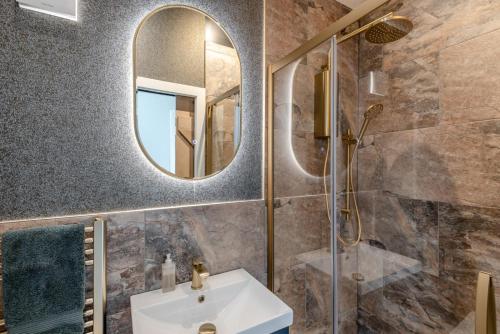 a bathroom with a sink and a mirror at 5 Bed in Haceby oc-c31061 in Haceby