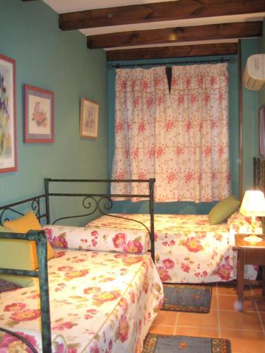 Ένα ή περισσότερα κρεβάτια σε δωμάτιο στο Apartamentos Saqura