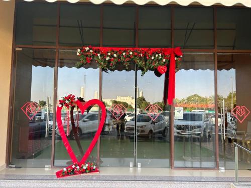 a store window with a valentines heart on display at Al Massa Plus Hotel in Al Ain