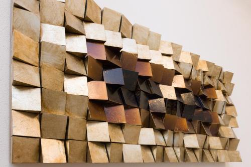 a pile of wood on the side of a wall at Vienna Stay Apartments Belvedere in Vienna