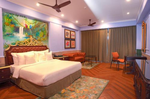 a hotel room with a bed and a piano at Mayfair Bay Resort Paradeep in Parādīp Garh