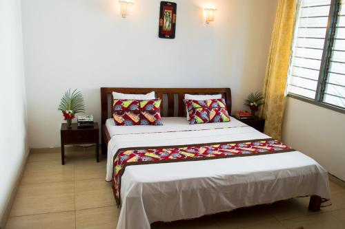 Postel nebo postele na pokoji v ubytování Paradise Resort Apartments