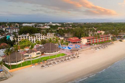 an aerial view of the beach at a resort at Grand Decameron Complex Bucerias, A Trademark All-Inclusive Resort in Bucerías