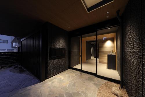 a room with glass doors on the side of a building at GRACE STAY Hiroshima Peace Memorial Park in Hiroshima