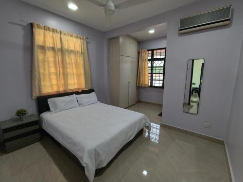 a bedroom with a white bed and a window at Together Hideaway Cheras 22pax 5R4B KTV, BBQ, ARCADE GAMES CHINESE, MALAY ONLY in Cheras