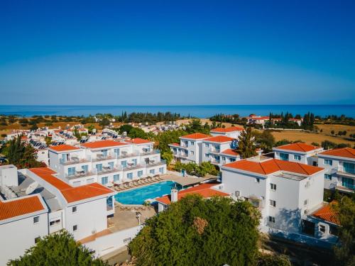 an aerial view of a resort with a swimming pool at Greek Village - Latchi הכפר היווני - כשר in Polis Chrysochous