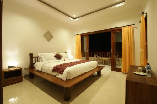 מיטה או מיטות בחדר ב-Soca Garden Guest house