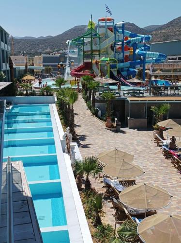 a resort with a pool and a water park at SunBay Hotel in Hersonissos