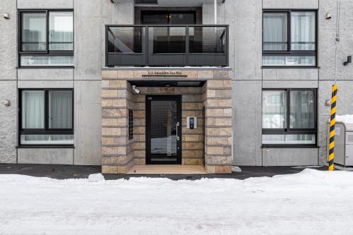 a building with a door in front of it at C L Susukino in Sapporo
