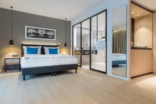 Un ou plusieurs lits dans un hébergement de l'établissement Radisson Blu Hotel, Mannheim