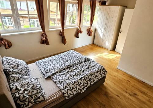 a bedroom with a bed with aoked sqor at Pferdeparadies Untergrünhagen in Bad Fallingbostel