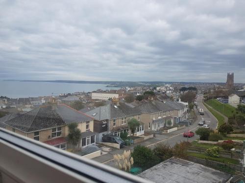 a view of a city with houses and the water at The Trelinda Guest House in Newquay
