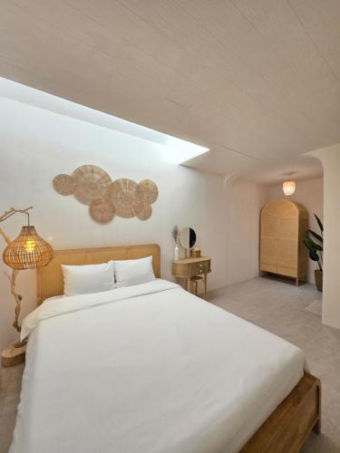 a bedroom with a large white bed in a room at La Solis in Incheon