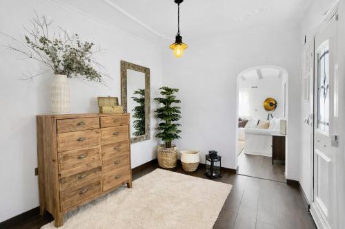 a living room with a dresser and a mirror at Lo Exclusive Denia Els Poblets - Villa with private pool near to beach in Els Poblets