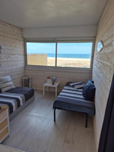 Llit o llits en una habitació de L'éveil Marin