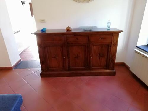 a wooden cabinet in the corner of a room at Antico Mulino in Imperia